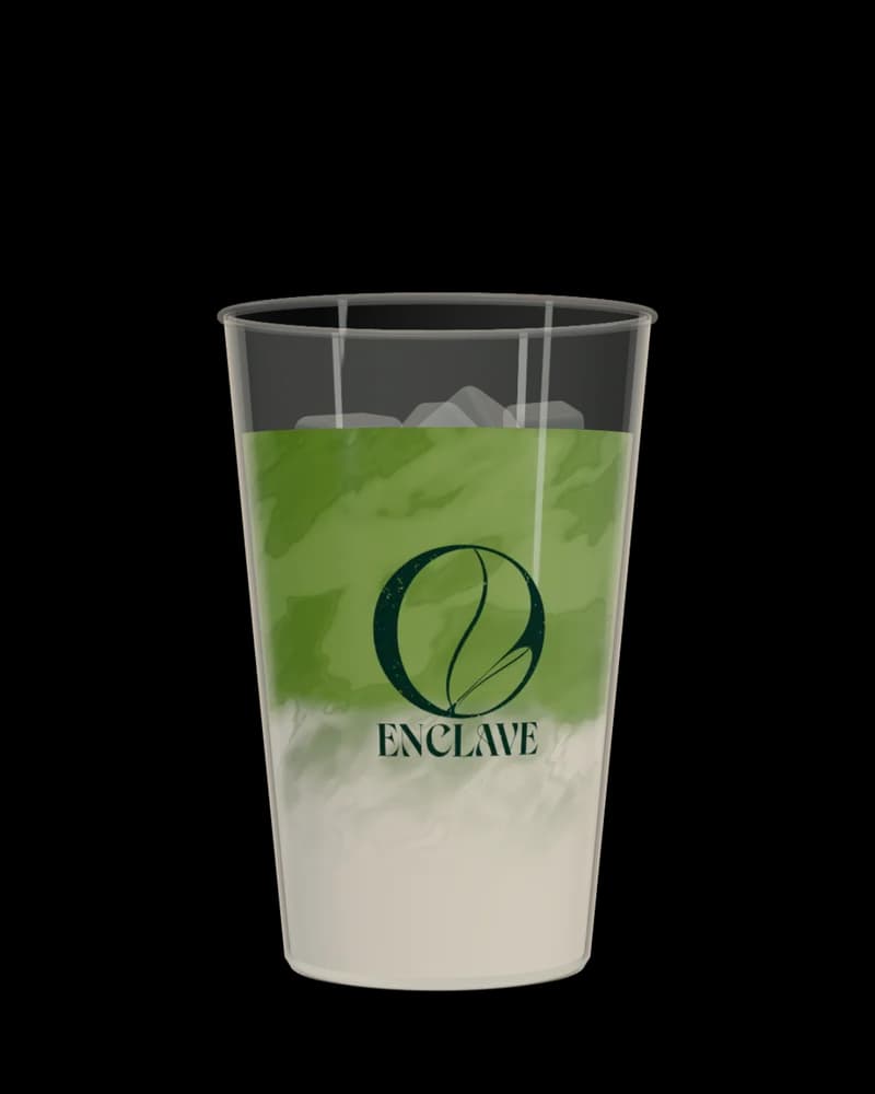 Matcha Latte in a clear Enclave cup.